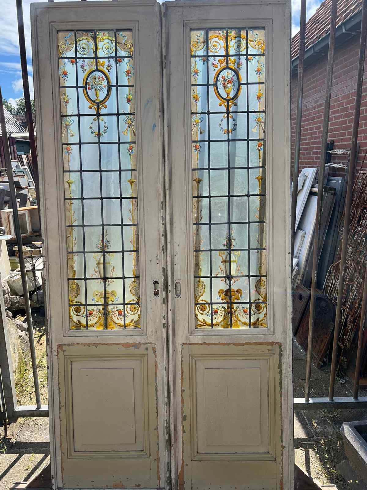 Bijzondere kamer en suite deuren met glas in lood